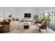 Comfortable living room with plush rug, sofa, and chairs at 13193 Tollcross Way, Winter Garden, FL 34787