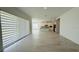 Open-concept living area with tile floors, kitchen, and natural light at 13193 Tollcross Way, Winter Garden, FL 34787