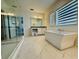 This luxurious bathroom boasts a soaking tub, elegant vanity, and a spacious glass shower at 13193 Tollcross Way, Winter Garden, FL 34787