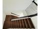 Wood staircase featuring decorative black metal railing at 13193 Tollcross Way, Winter Garden, FL 34787