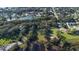 Scenic aerial view featuring a serene pond and a lush green property, creating a beautiful natural landscape at 4321 Rummell Rd, St Cloud, FL 34769