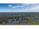 An aerial view of a property featuring a waterfront lot with mature trees, and marshland at 4321 Rummell Rd, St Cloud, FL 34769