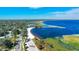 An aerial view featuring a beachfront area, with a parking lot and neighborhood nearby at 4321 Rummell Rd, St Cloud, FL 34769