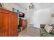 Cozy bedroom featuring wood-look floors, ample storage and a flatscreen tv at 4321 Rummell Rd, St Cloud, FL 34769