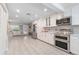 Bright, remodeled kitchen with stainless steel appliances and ample counter space at 4321 Rummell Rd, St Cloud, FL 34769