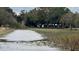 Scenic lakefront property with lush vegetation and a tranquil waterfront view at 4321 Rummell Rd, St Cloud, FL 34769