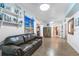 Comfortable living room with neutral tones, open shelving and view into the kitchen at 4321 Rummell Rd, St Cloud, FL 34769