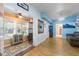 Cozy living room with a decorative rug and a view into the kitchen at 4321 Rummell Rd, St Cloud, FL 34769