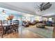 Spacious living and dining area featuring a large ceiling fan and hardwood floors at 4321 Rummell Rd, St Cloud, FL 34769