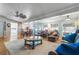 Open concept living room and dining area with hardwood floors and cozy seating at 4321 Rummell Rd, St Cloud, FL 34769