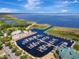 Scenic view of a marina, with many boats, a lake in the background, and blue skies above at 4321 Rummell Rd, St Cloud, FL 34769
