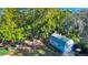 Spacious yard with shed, greenery, and mature trees at 4321 Rummell Rd, St Cloud, FL 34769
