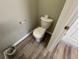 Small half bathroom with toilet and pedestal sink at 523 Royal Ridge Dr, Davenport, FL 33837