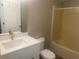 Clean bathroom with white vanity, bathtub, and updated fixtures at 523 Royal Ridge Dr, Davenport, FL 33837