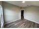 Bright bedroom featuring wood-look floors and an open feel at 523 Royal Ridge Dr, Davenport, FL 33837