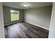 Spacious bedroom with large window and wood-look floors at 523 Royal Ridge Dr, Davenport, FL 33837