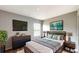 Cozy bedroom featuring modern furniture, a TV, and soft natural lighting at 8544 Palm Harbor Dr, Kissimmee, FL 34747