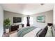Relaxing bedroom featuring a large bed, a TV, and soft natural lighting at 8544 Palm Harbor Dr, Kissimmee, FL 34747