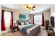 Comfortable main bedroom with large bed, ensuite bathroom, and natural light at 8544 Palm Harbor Dr, Kissimmee, FL 34747