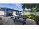 Backyard patio with picnic table and fire pit at 4344 Ilene Ct, Orlando, FL 32806