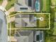 An aerial view showing the backyard entertainment area with a fire pit, with the home outlined in yellow at 5249 Villa Rosa Ave, St Cloud, FL 34771