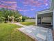 Picturesque backyard with a fire pit and landscaped pathway at 5249 Villa Rosa Ave, St Cloud, FL 34771