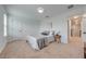 Inviting bedroom with a neutral color palette and an ensuite at 5249 Villa Rosa Ave, St Cloud, FL 34771