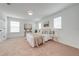 Bright bedroom with neutral color palette, carpeted floors, and lots of natural light from the two windows at 5249 Villa Rosa Ave, St Cloud, FL 34771