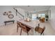 Open-concept dining room with table and chairs leading to living room and staircase at 5249 Villa Rosa Ave, St Cloud, FL 34771