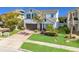 Inviting two-story home featuring a manicured lawn and a brick-paved driveway leading to a two-car garage at 5249 Villa Rosa Ave, St Cloud, FL 34771