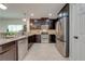 Well-equipped kitchen features stainless steel appliances, tile backsplash, and granite countertops at 5249 Villa Rosa Ave, St Cloud, FL 34771
