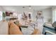 Comfortable living room with a dining area and kitchen in the background at 5249 Villa Rosa Ave, St Cloud, FL 34771