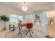 A modern office space with a stylish desk, comfortable chairs, and plenty of natural light at 5249 Villa Rosa Ave, St Cloud, FL 34771