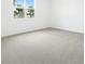 Spacious carpeted bedroom with large window at 1753 Carnelian St, Deland, FL 32720