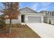 Charming home featuring stone accents, manicured landscaping, and a two-car garage at 1753 Carnelian St, Deland, FL 32720