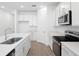 Modern kitchen featuring stainless steel appliances and a spacious island with sink at 1753 Carnelian St, Deland, FL 32720