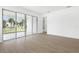 Bright living room with sliding glass doors and tile flooring at 1753 Carnelian St, Deland, FL 32720