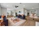 Bright living room with modern furniture, hardwood floors, and neutral paint colors at 905 Valencia Rd, South Daytona, FL 32119