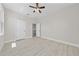 Large bedroom with light wood floors and multiple doorways at 1415 Orlando Way, Kissimmee, FL 34759