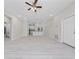 Open concept living room showcases the kitchen, dining and living spaces at 1415 Orlando Way, Kissimmee, FL 34759