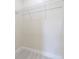 Clean, empty walk-in closet features white walls, light wood flooring, and a wire shelf at 1415 Orlando Way, Kissimmee, FL 34759