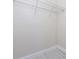 Interior view of a walk-in closet with white walls, wire shelving, and light wood flooring at 1415 Orlando Way, Kissimmee, FL 34759