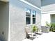 Cozy patio area with chairs and a small table, perfect for outdoor relaxation at 1608 Cross Prairie Pkwy, Kissimmee, FL 34744