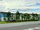 Street view of new construction homes, featuring various colors and architectural styles at 1608 Cross Prairie Pkwy, Kissimmee, FL 34744