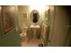 Small bathroom with pedestal sink and toilet at 2041 Dixie Belle Dr # 2041P, Orlando, FL 32812