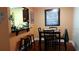 Cozy dining area with a small table and kitchen pass-through at 2041 Dixie Belle Dr # 2041P, Orlando, FL 32812