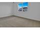 Bright bedroom with neutral carpet and a window offering natural light at 5410 Catmint Dr, Lake Hamilton, FL 33851