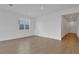 Bright living room features neutral tile flooring, a large window and neutral walls at 5410 Catmint Dr, Lake Hamilton, FL 33851