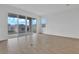 Spacious living room with tile flooring and sliding glass doors leading to the backyard at 5410 Catmint Dr, Lake Hamilton, FL 33851