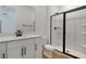 Bright bathroom featuring modern vanity and walk in shower with glass door at 4060 Bannock Ave, Tavares, FL 32778